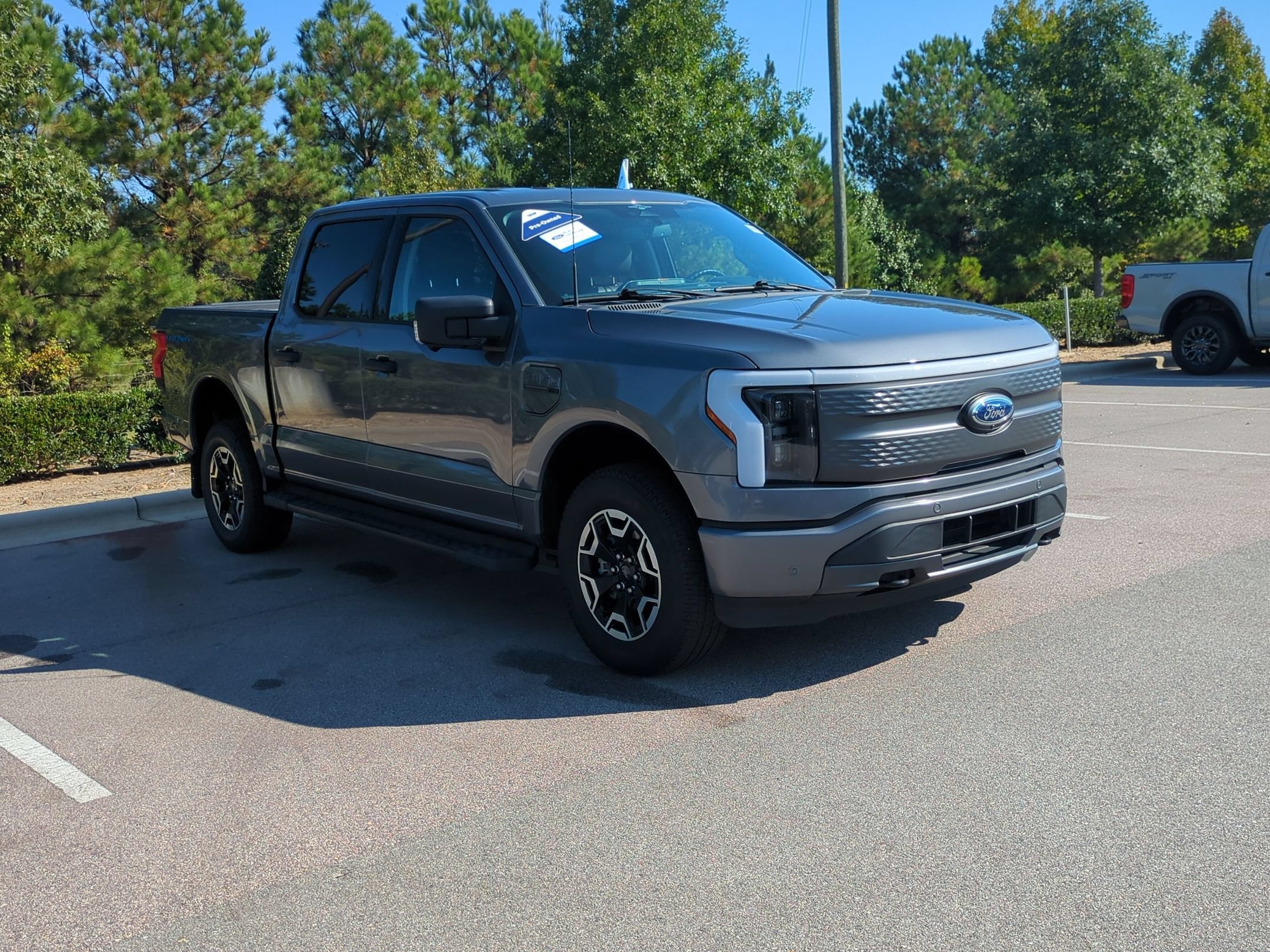 Certified 2023 Ford F-150 Lightning XLT with VIN 1FTVW1EL7PWG43241 for sale in Apex, NC